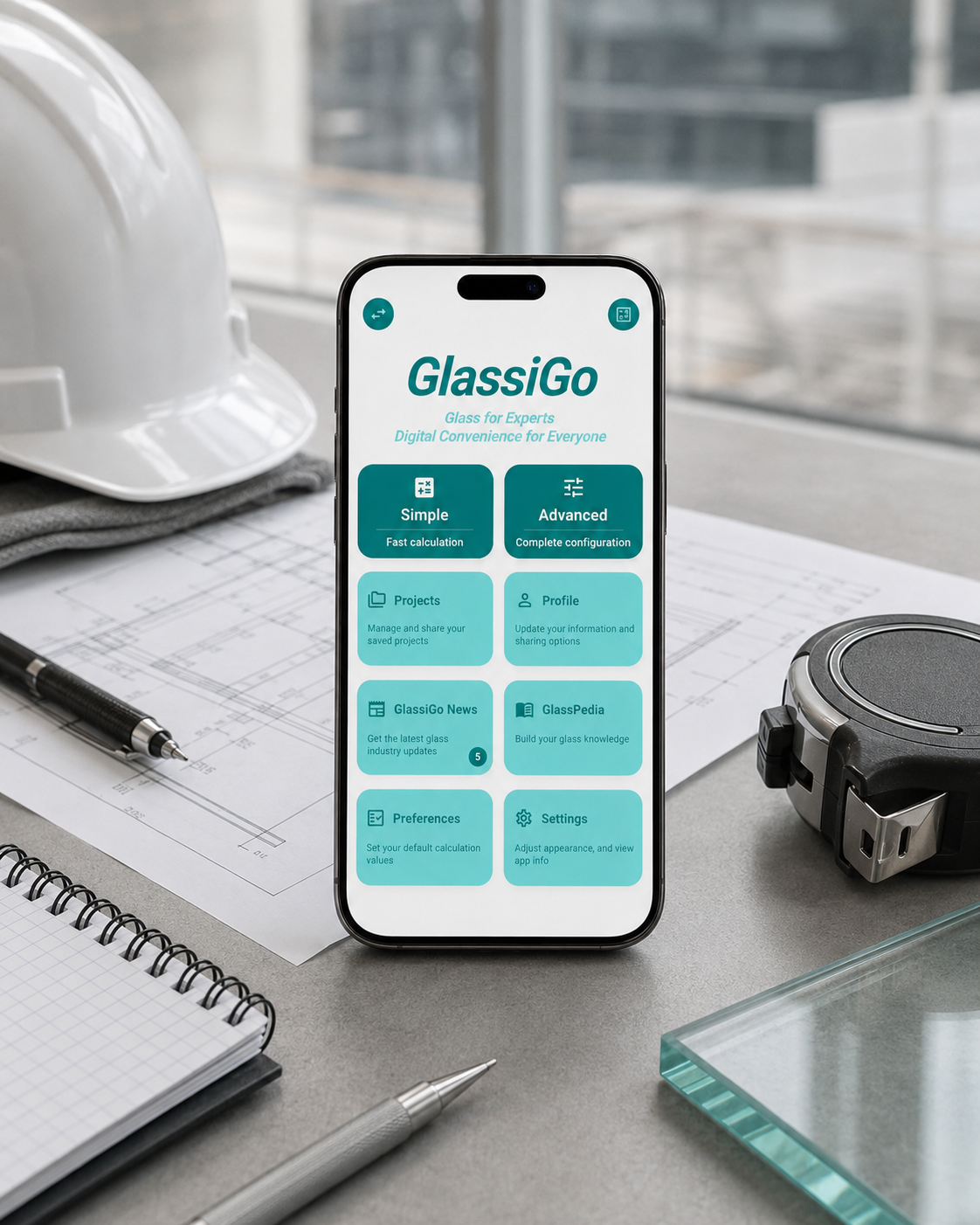 GlassiGo workstation view on a phone beside glass plans